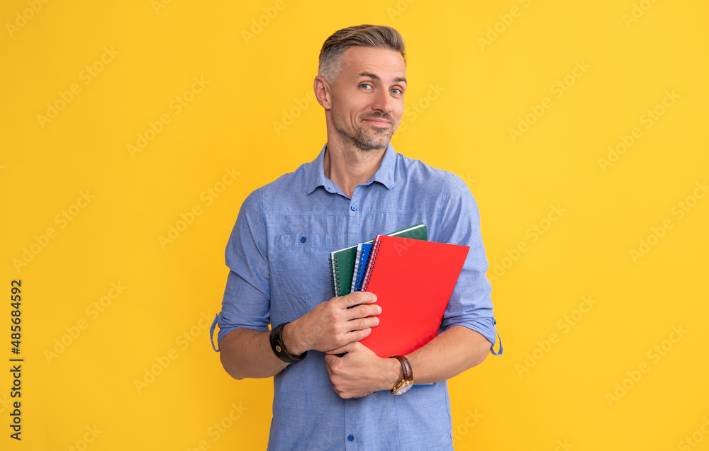 smiling man hold school notebook or planner, teacher smiling man hold school notebook or planner, teacher