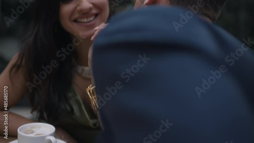 cute couple chatting over a cup of coffee
