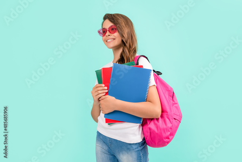 happy child with backpack and copybook in sunglasses ready to study at school, back to school