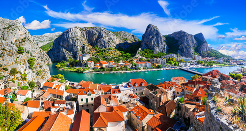 Fototapeta Naklejka Na Ścianę i Meble -  Landmarks of Croatia - impressive Omis town surrounded with mountain gorge, over Cetina river. Popular tousrit destination