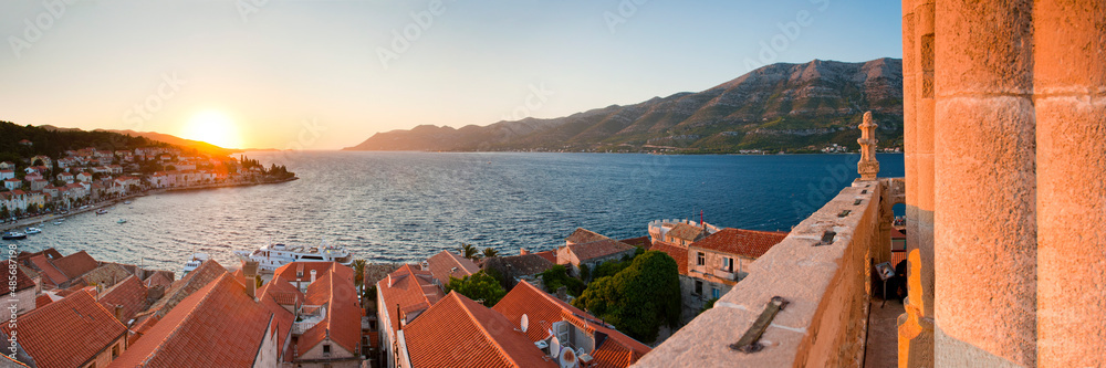 St Marks Cathedral bell tower and Korcula Town, panoramic photo at sunset, Croatia