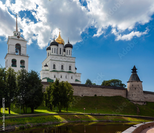 View of Pskov Kremlin with domes ofTrinity Cathedral, Bell Tower and Middle Tower against summer sky.