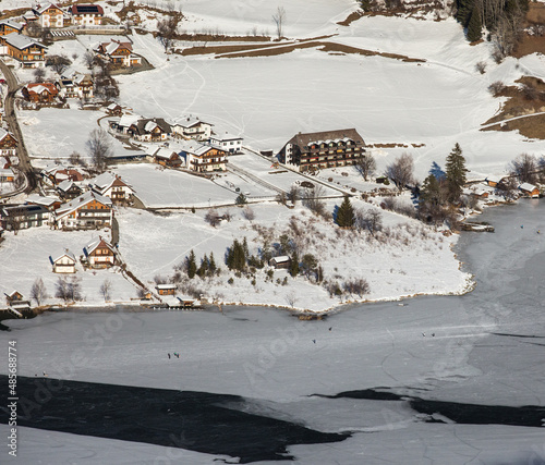 aerial view over frozen alpine lake in Austria in winter