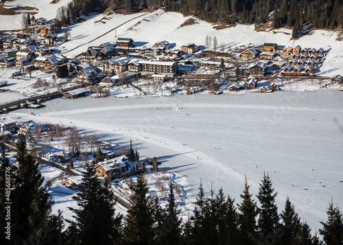 aerial view over frozen alpine lake in Austria in winter