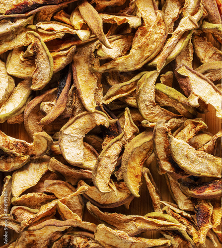 Background from dried pears. Dried fruits. Texture. Chips from dried fruits.