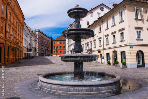 Ljubljana, fountain on the Breg Embankment at Novi Trg in the centre of Ljubljana, Slovenia, Europe