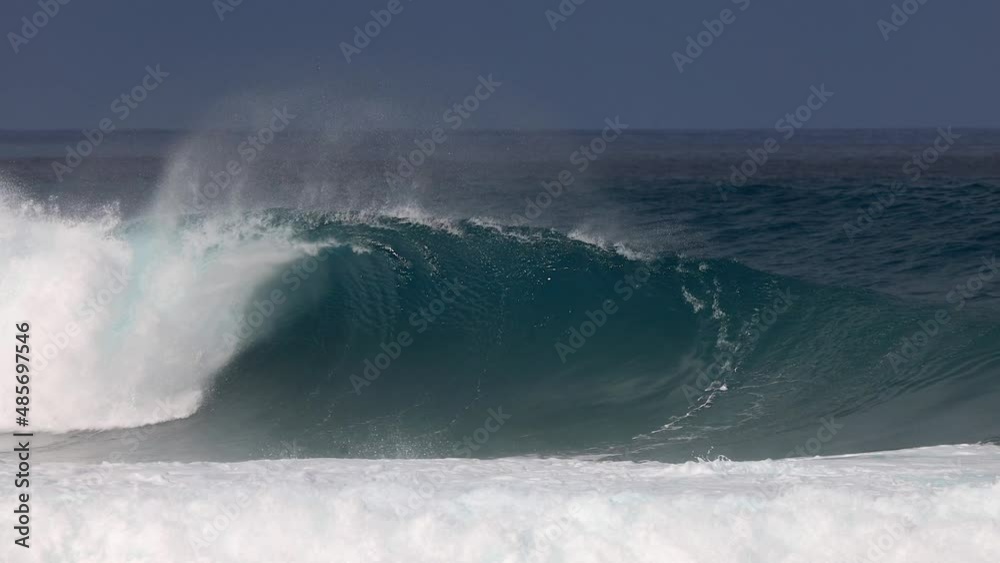 A huge perfect wave barrel in Hawaii in slow motion A huge perfect wave barrel in Hawaii in slow motion