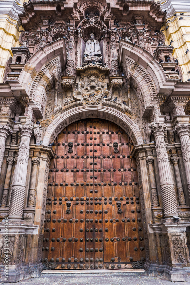 Large wooden church doors in historic centre of Lima, Lima Province, Peru, South America