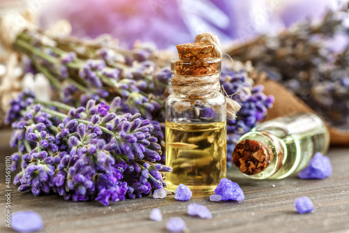 lavender s spa products with dried lavender flowers on a wooden table. Flat lay bath salt and massage oil on wooden background. Skin care  beauty treatment concept. Lavendula oleum