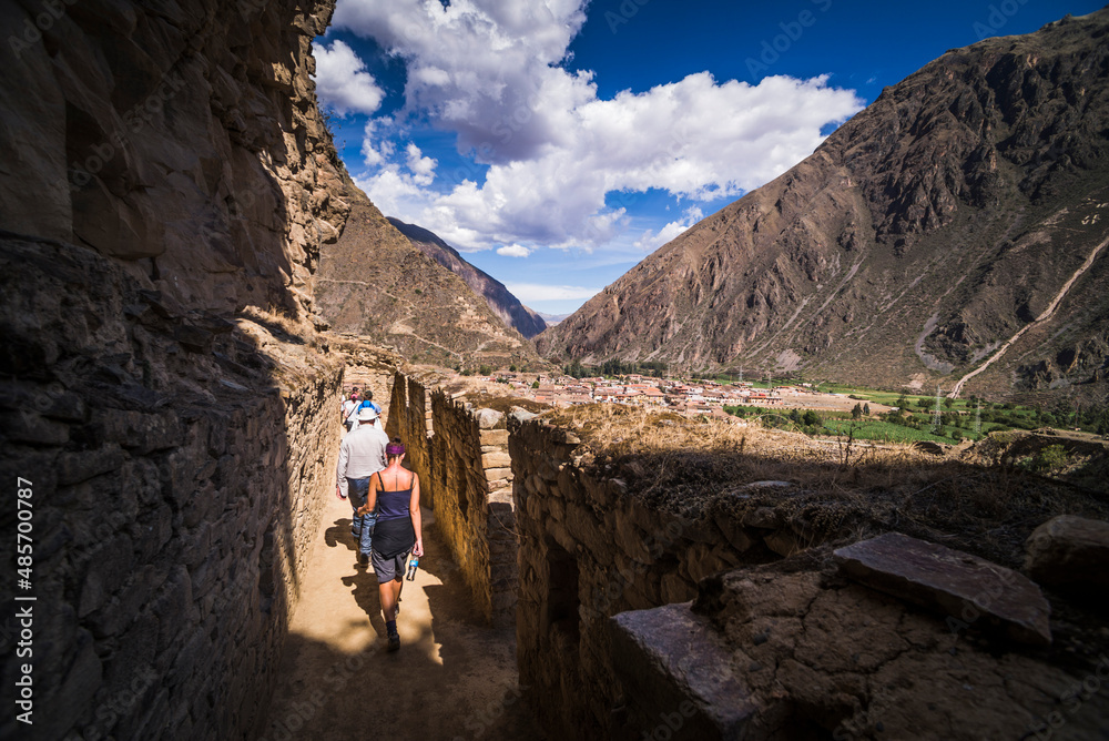 Tourists exploring Inca Ruins of Ollantaytambo, Sacred Valley of the Incas (Urubamba Valley), near Cusco, Peru, South America