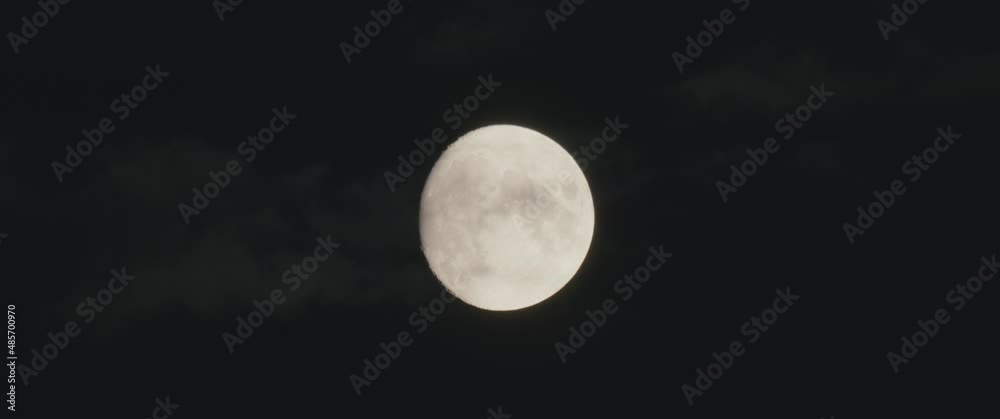 Moon on the cloudy dark night sky nature slow clouds move slowly over Moon on the cloudy dark night sky nature slow clouds move slowly over