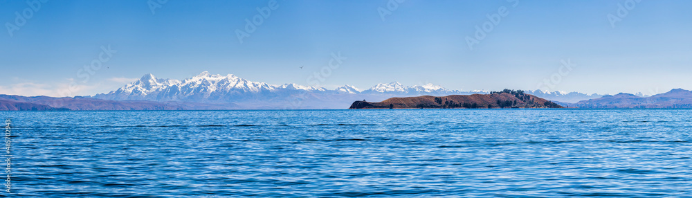 Cordillera Real Mountain Range (part of Andes Mountains) behind Lake Titicaca, seen from Isla del Sol, Bolivia, South America