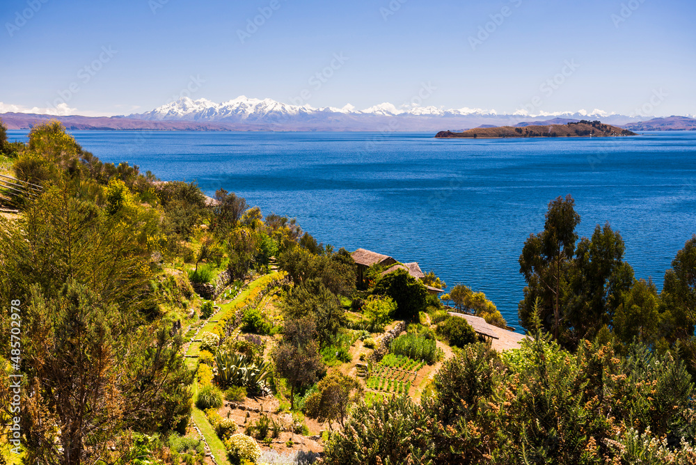 Isla del Sol (Island of the Sun) farm land with Cordillera Real Mountain Range behind, Lake Titicaca, Bolivia, South America