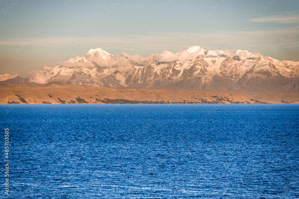 Sunset Cordillera Real Mountain Range (part of Andes Mountain Range) and Lake Titicaca, seen from Isla del Sol, Bolivia, South America