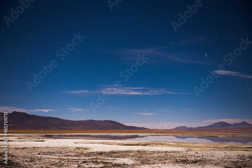 Stars over Chalviri Salt Flats at night (aka Salar de Chalviri), Altiplano of Bolivia in Eduardo Avaroa National Reserve of Andean Fauna, South America