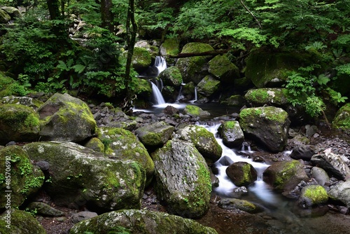 trekking around river and waterfall in summer photo