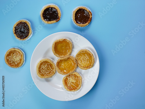 Wallpaper Mural Pie flavored with chocolate, pineapple, and cheese on blue background Torontodigital.ca