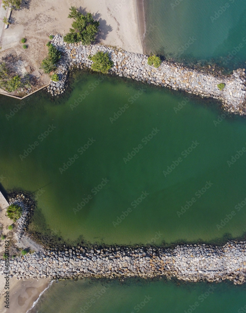 Aerial photos of a wavebreaker, taken from a drone, where you can see ...
