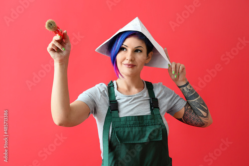 Female painter with paper h...