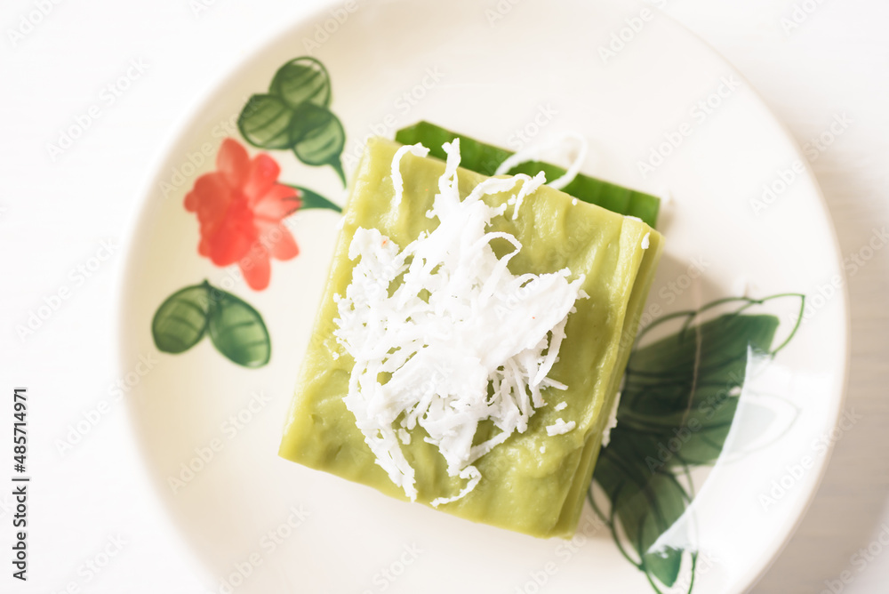 Pandanus pudding with coconut topping on white background, Traditional sweets that are cultural heritage of Asia.