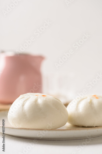 Steamed Chinese bun on white background, a popular Asian street food