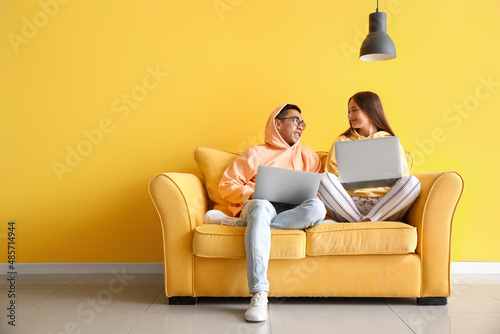 Young couple with laptops s...