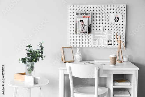 Stylish workplace with diff...