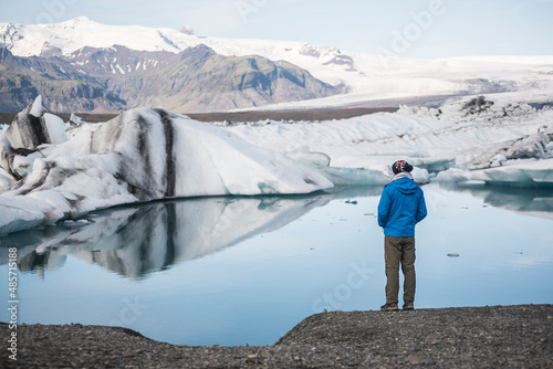 Conservationist thinking about the future of climate change and global warming, and teh climate emergency at Jokulsarlon Glacier Lagoon, South East Iceland, Europe photo