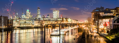 Bankside Pier and the Thames, with 'The City' behind at night, London, England, United Kingdom
