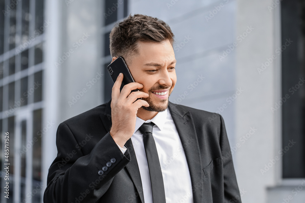 Stylish businessman talking by mobile phone near office building, closeup Stylish businessman talking by mobile phone near office building, closeup