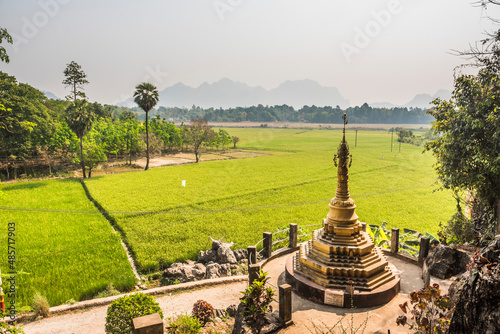 Gold stupa and rice paddy fields at Kaw Ka Thawng Caves, Hpa An, Kayin State (Karen State), Myanmar (Burma)