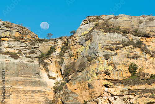 Moon over mountains of Isalo National Park, Ihorombe Region, Southwest Madagascar photo