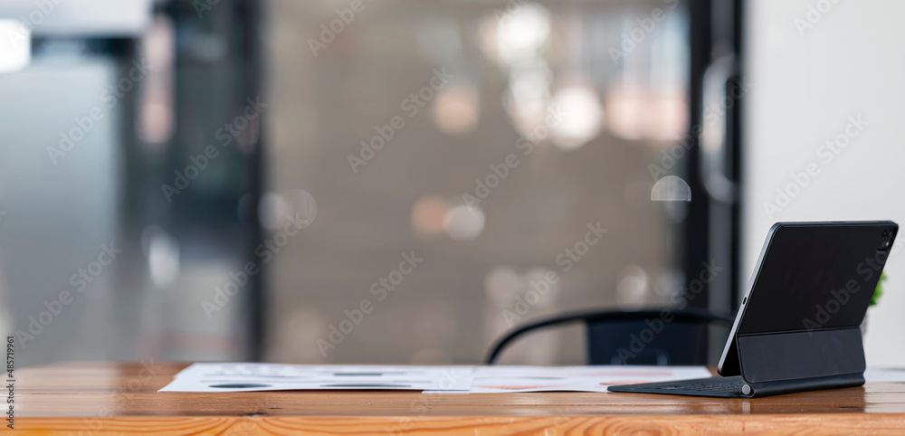 Modern home office mockup with digital tablet and magic keyboard on wooden table. Creative workspace. Modern home office mockup with digital tablet and magic keyboard on wooden table. Creative workspace.