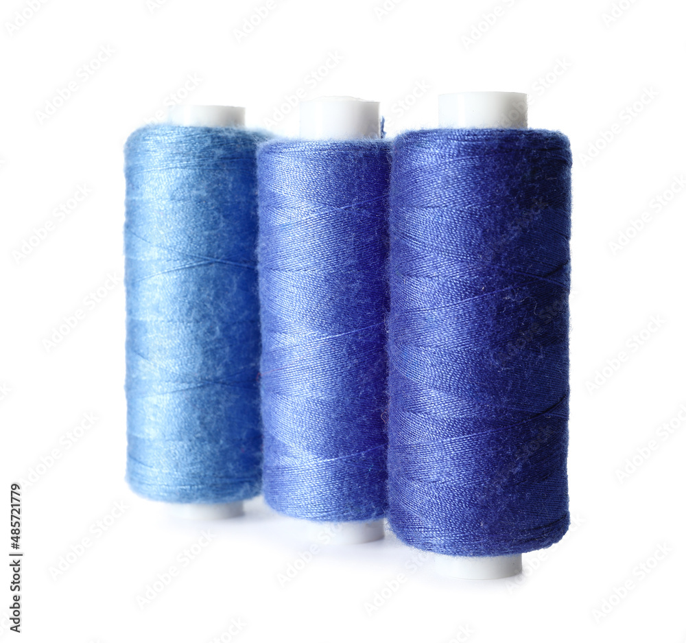 Blue sewing threads on white background Blue sewing threads on white background