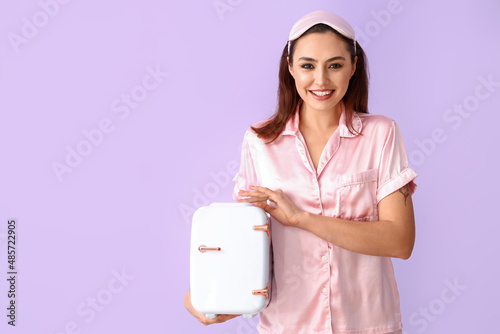 Smiling woman in pink silk ...