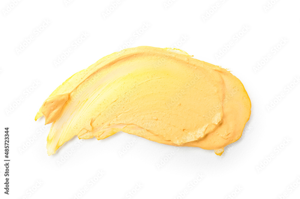Smear of turmeric mask on white background Smear of turmeric mask on white background