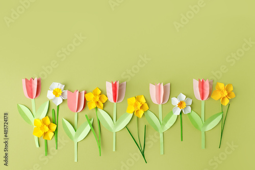 Happy easter spring concet - papercraft seasonal flowers on blue background for kids holiday party concept background. Handicrafts, DIY. creative idea from paper, copy space, banner, flyer