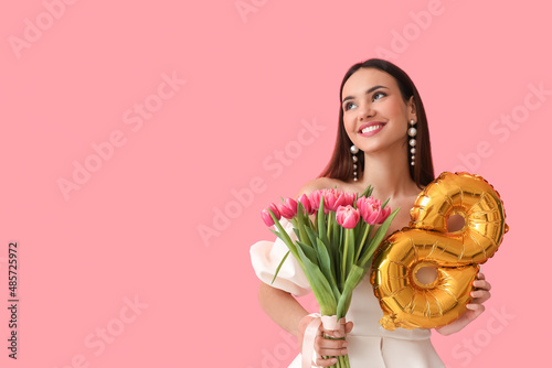 Stylish young woman with tu...