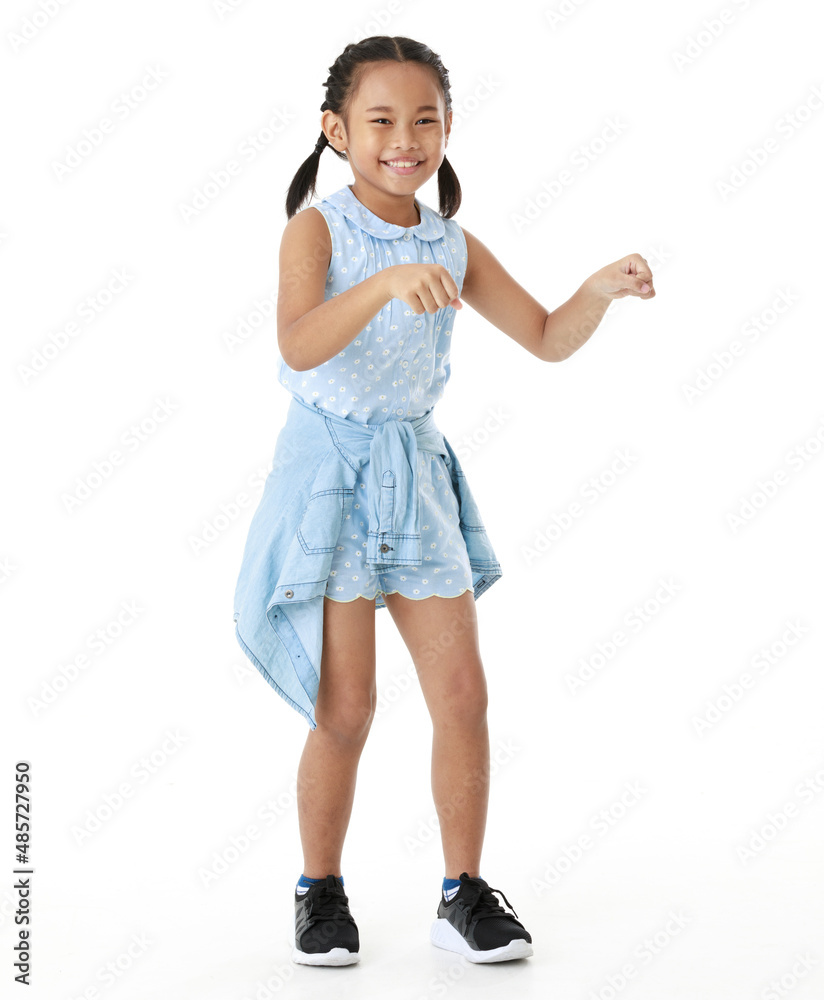 Portrait full body studio cutout shot of Asian young happy cheerful pigtail braid hairstyle elementary school girl in blue sleeveless dress standing posing smiling look at camera on white background Portrait full body studio cutout shot of Asian young happy cheerful pigtail braid hairstyle elementary school girl in blue sleeveless dress standing posing smiling look at camera on white background