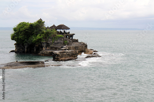 Temple of Tanah Lot, rock formation, in the middle of the sea. Taken January 2022.