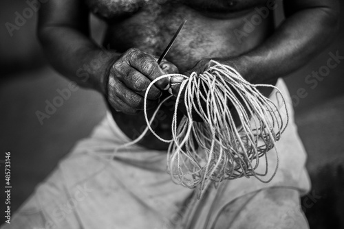 Fisherman at Kappil Beach, Varkala, Kerala, India photo