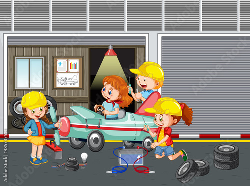 Children repairing a car together in the garage
