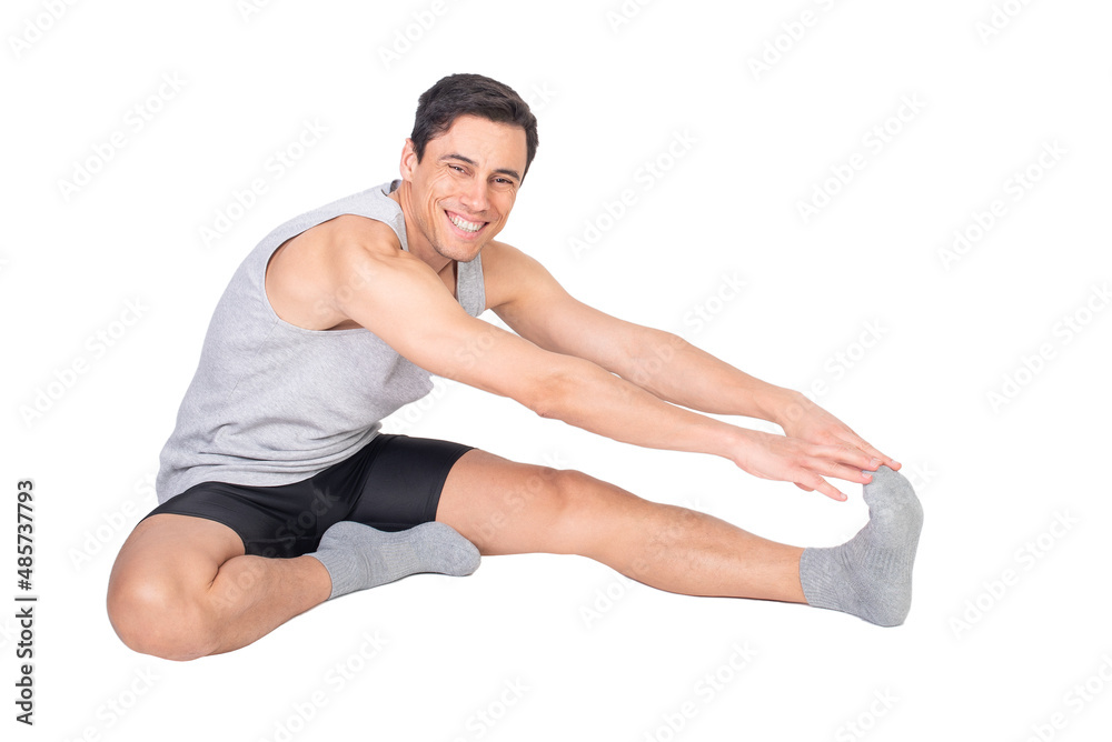 Happy sportsman stretching hamstring muscle in studio Happy sportsman stretching hamstring muscle in studio