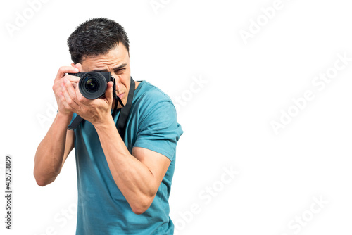 Concentrated man taking photo on professional camera