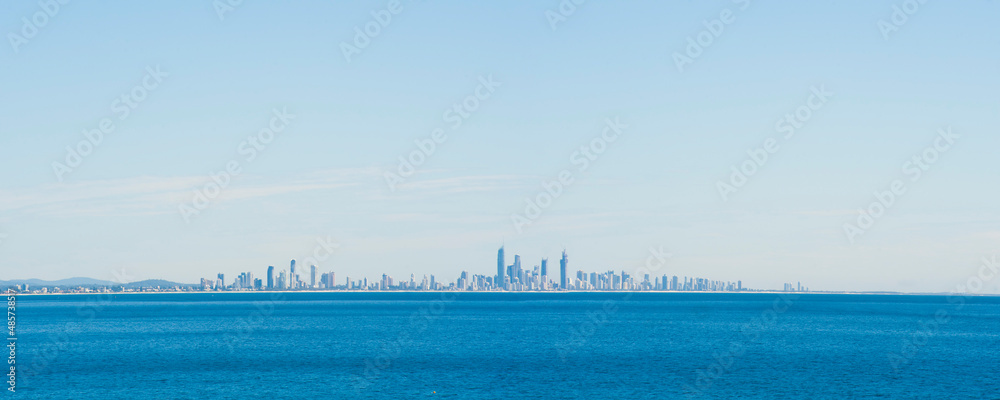View Across the Ocean to the City Skyline of Surfers Paradise from Coolangatta Beach, Gold Coast, Australia, background with copy space