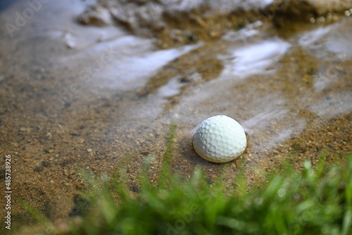 golf ball in water hazard