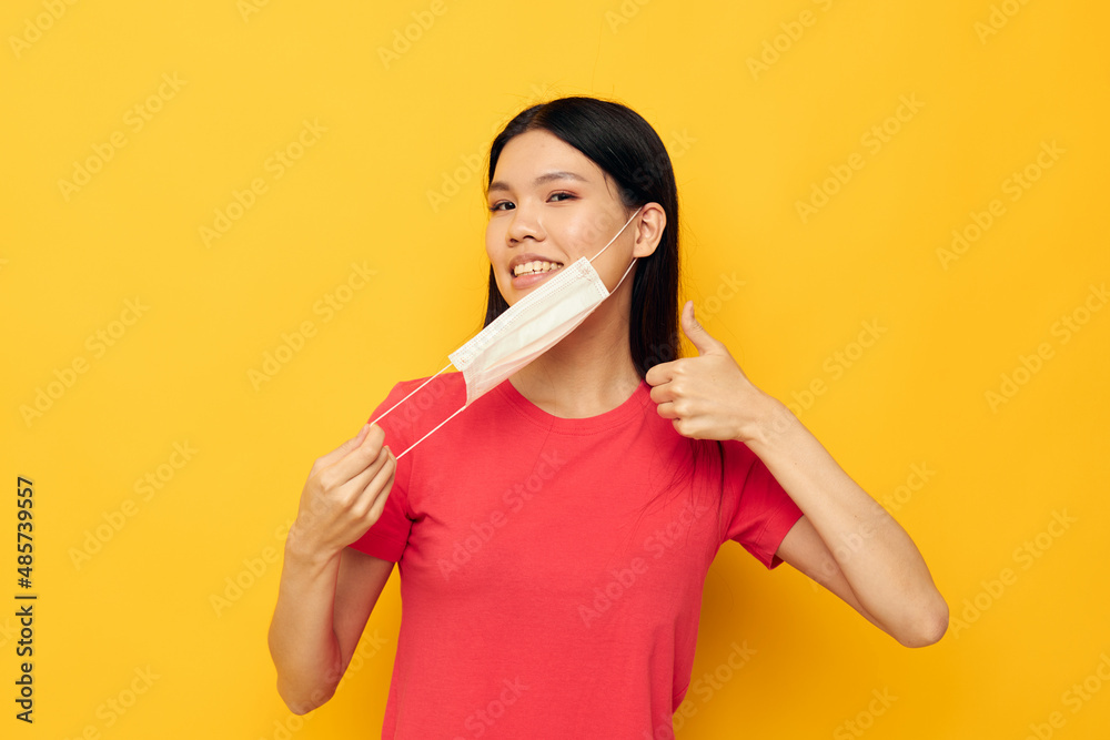 Charming young Asian woman posing medical mask close-up studio model unaltered Charming young Asian woman posing medical mask close-up studio model unaltered