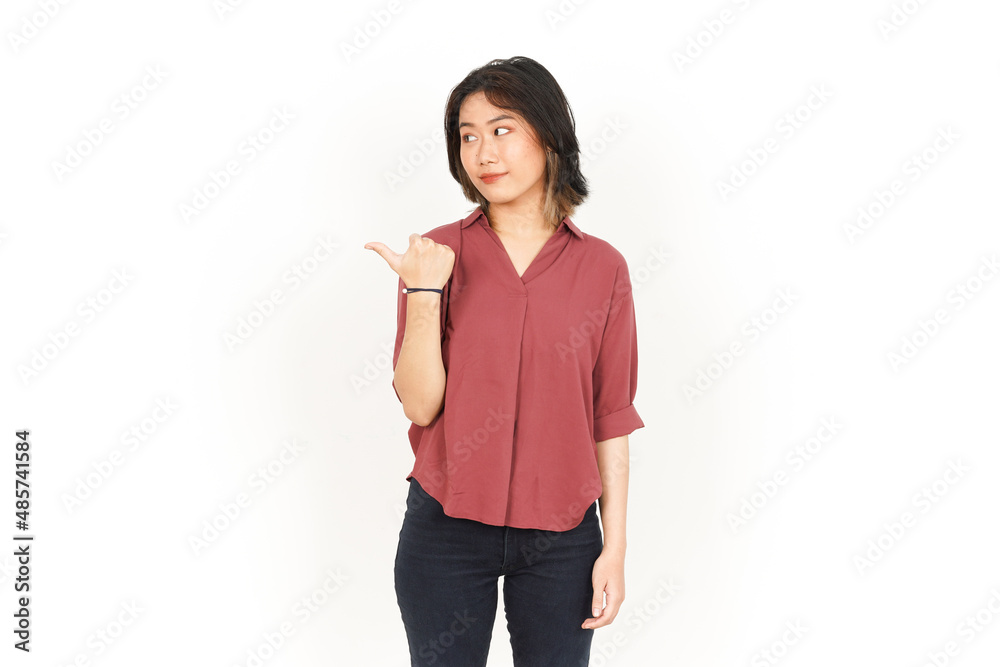 Showing Product and Pointing Side Using Thumb Of Beautiful Asian Woman Isolated On White Background Showing Product and Pointing Side Using Thumb Of Beautiful Asian Woman Isolated On White Background