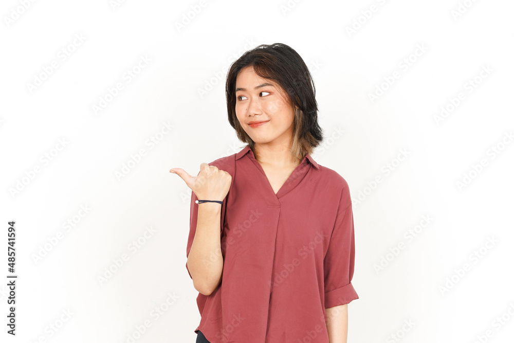 Showing Product and Pointing Side Using Thumb Of Beautiful Asian Woman Isolated On White Background Showing Product and Pointing Side Using Thumb Of Beautiful Asian Woman Isolated On White Background