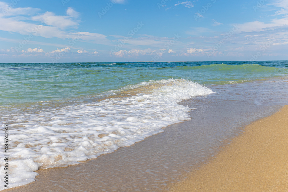 Beautiful bright colorful tropical summer background. Soft turquoise blue ocean wave on golden sandy beach.